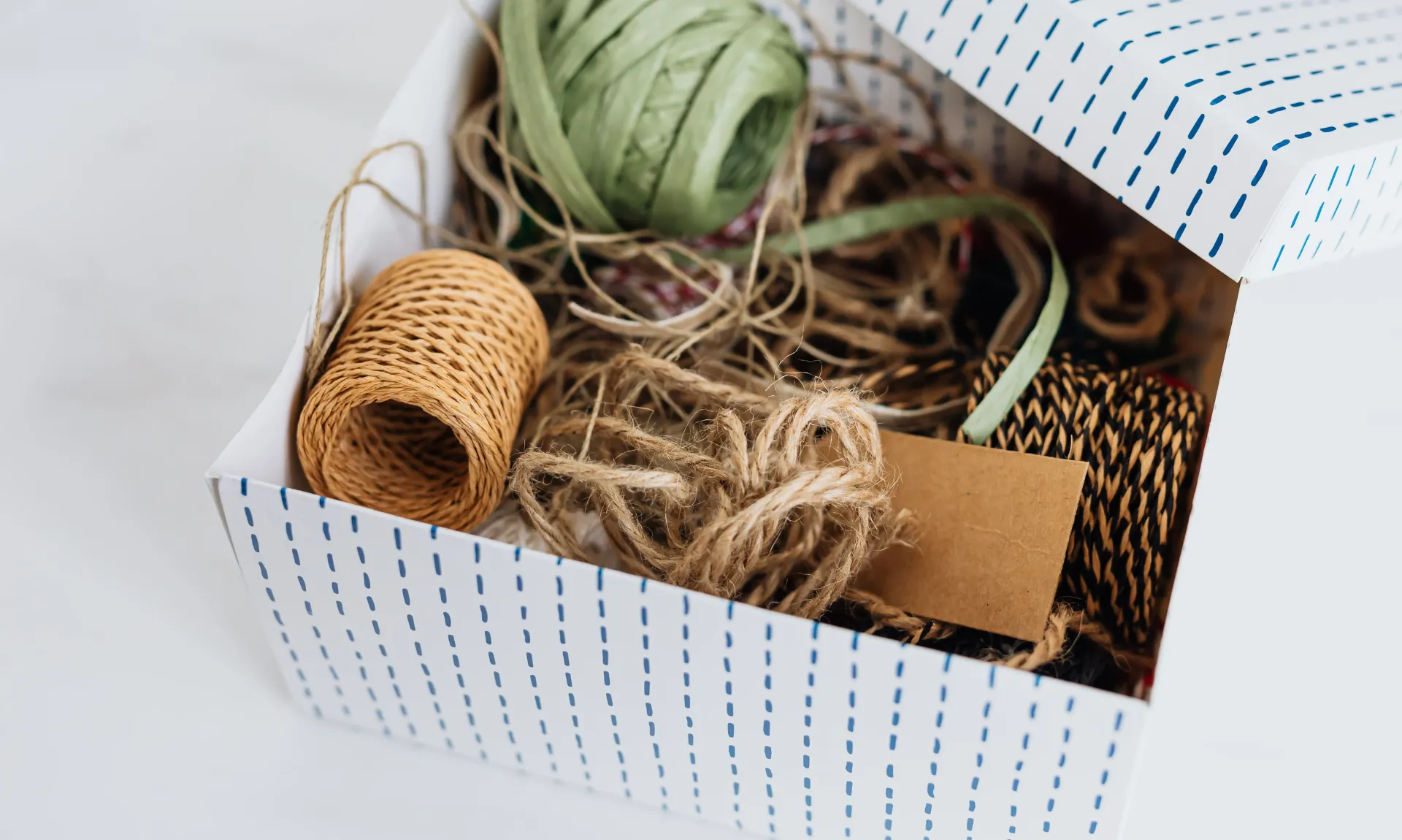 DIY home decor ideas for beginners using a cardboard storage box and simple craft supplies to create stylish budget-friendly home organization