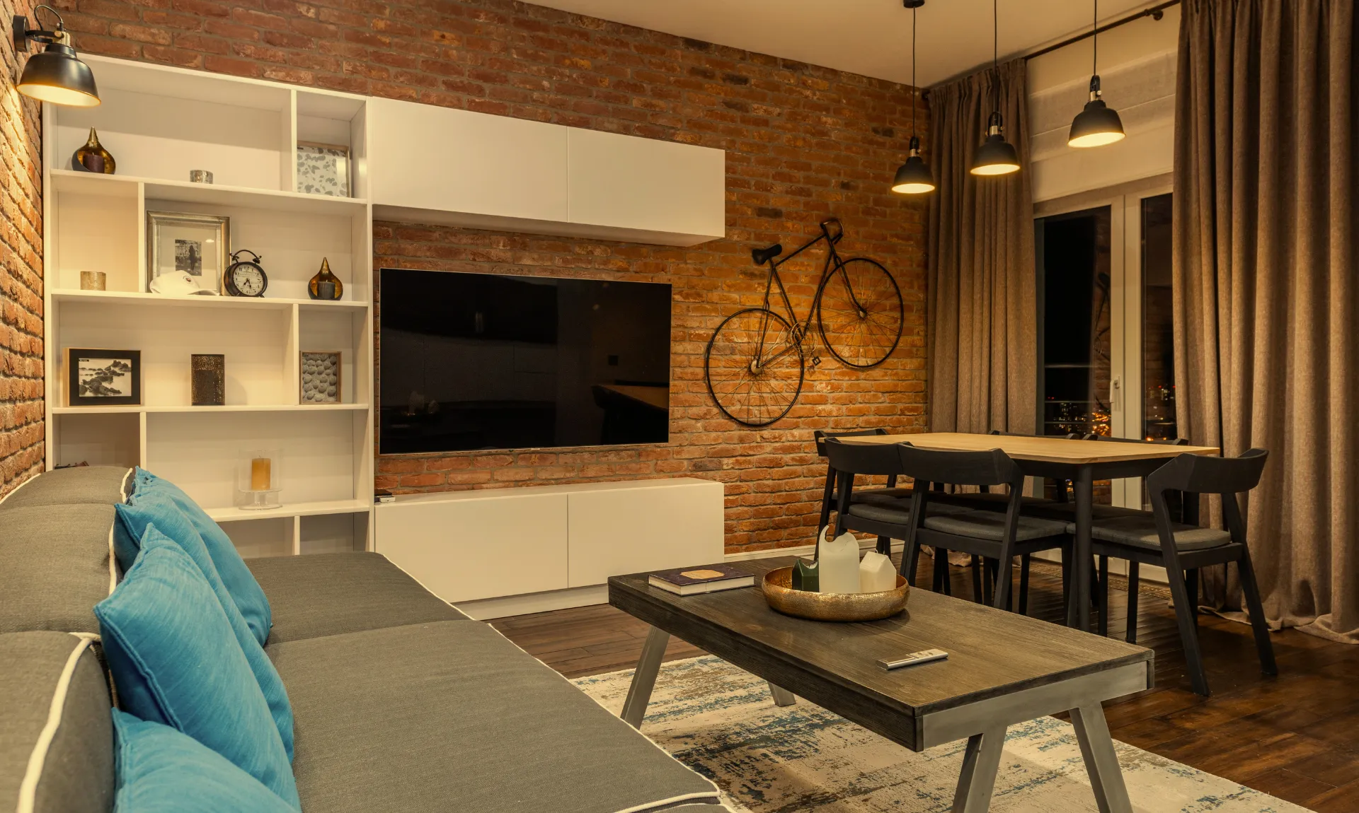 A living room using the home decor principle of layered lighting for a warm and aesthetic vibe
